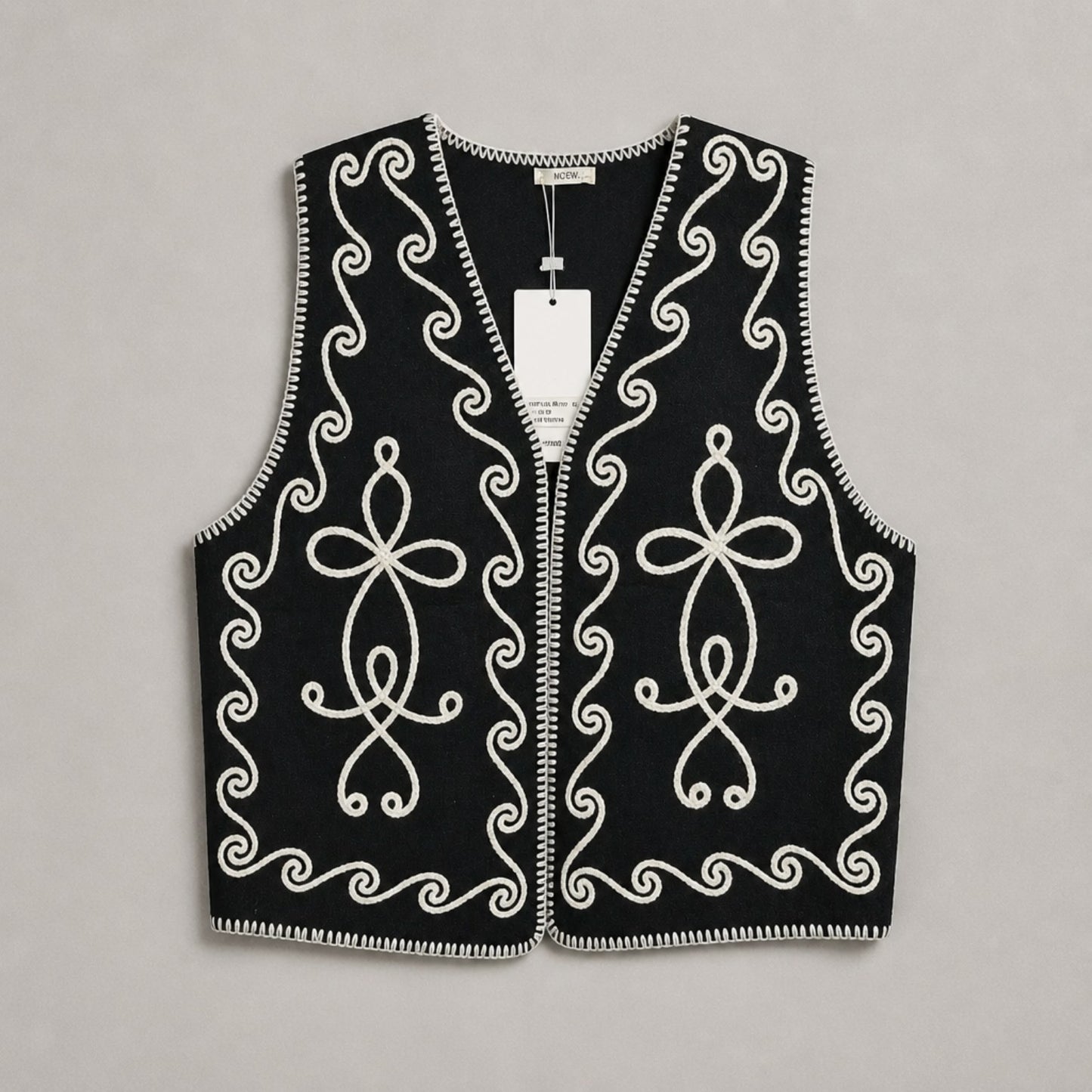 Strickweste mit Ornamentstickerei – Schwarz & Creme Weste Das Zierwerk