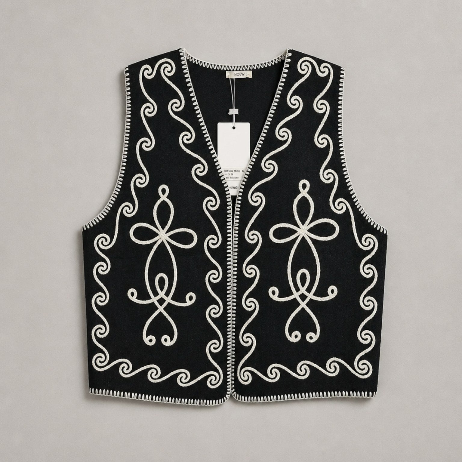 Strickweste mit Ornamentstickerei – Schwarz & Creme Weste Das Zierwerk