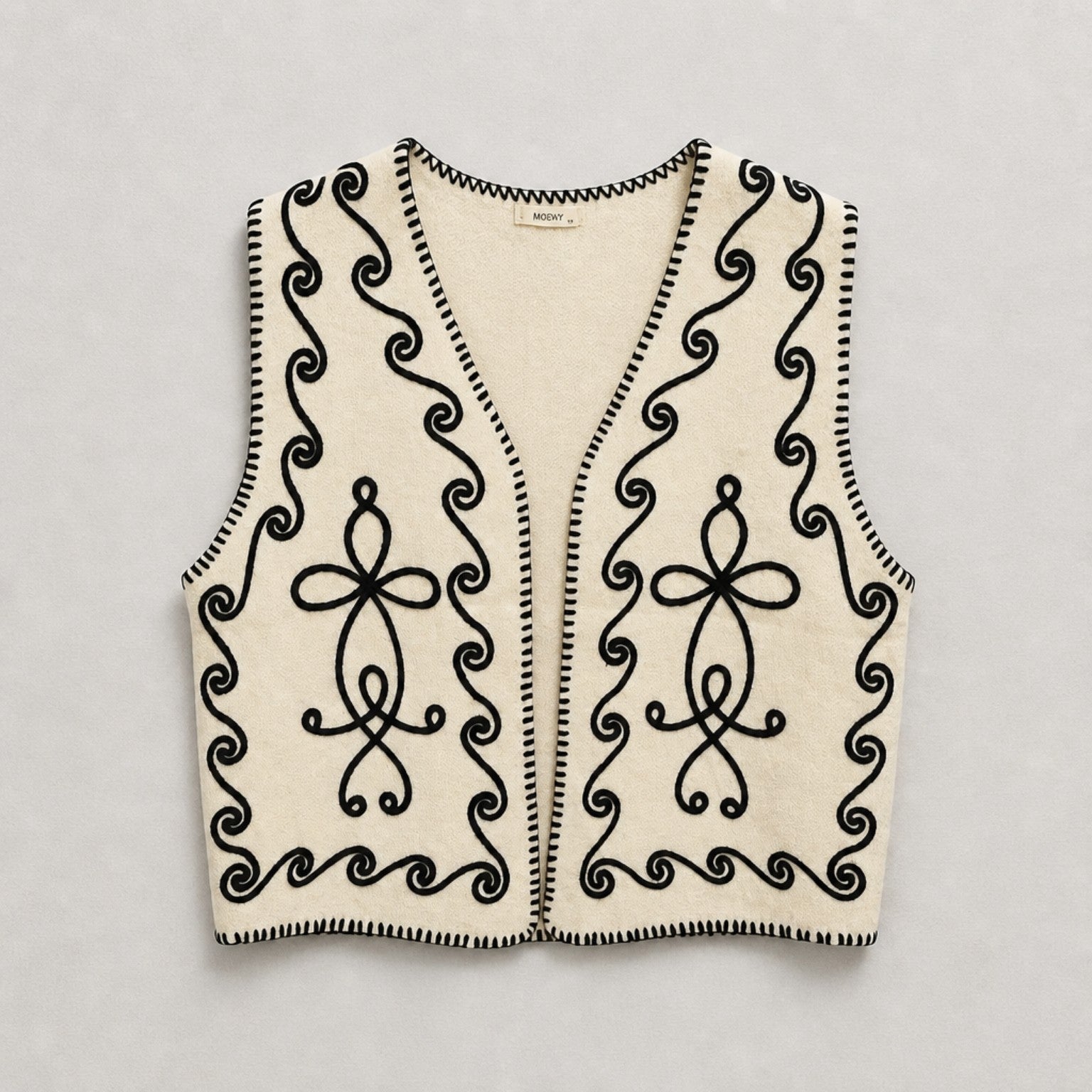 Strickweste mit Stickerei – Creme & Schwarz Weste Das Zierwerk